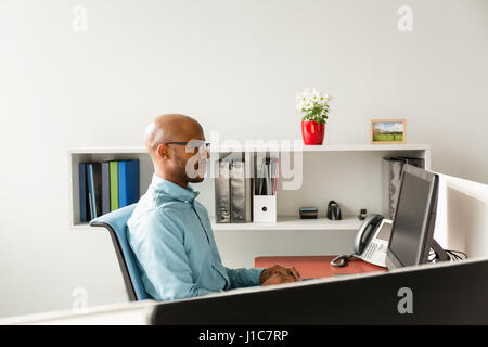 African American man using computer in office Stock Photo