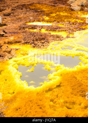 Mineral formations at sulphur lake Dallol in a volcanic crater in the Danakil Depression, northeast of the Erta Ale Range in Ethiopia. The lake with i Stock Photo