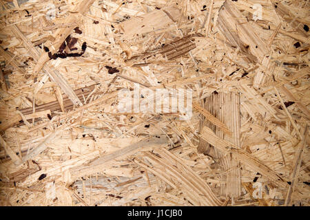 Recycled compressed wood chipboard. Pressed Wooden Panel (OSB). Stock Photo