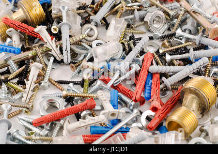 Nuts bolts and screws isolated over white background Stock Photo