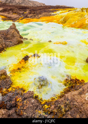 Mineral formations at sulphur lake Dallol in a volcanic crater in the Danakil Depression, northeast of the Erta Ale Range in Ethiopia. The lake with i Stock Photo