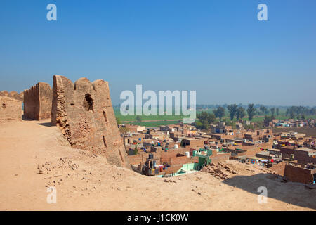 ongoing restoration work at bhatner fort overlooking the colorful buildings of hanumangarh town with views of the rajasthan countryside under a clear  Stock Photo