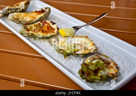 Oysters Rockefeller on a half shell Stock Photo