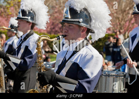 Sax player in a high school marching band during a street parade - USA Stock Photo