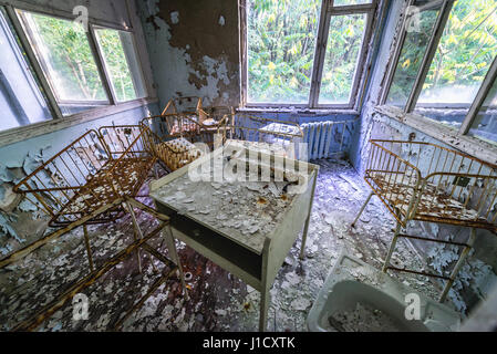 Maternity ward in Hospital No. 126 of Pripyat ghost city, Chernobyl Nuclear Power Plant Zone of Alienation around nuclear reactor disaster, Ukraine Stock Photo