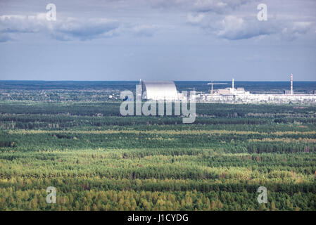 New Safe Confinement seen from Duga near Cherobyl town in Chernobyl Nuclear Power Plant Zone of Alienation in Ukraine Stock Photo