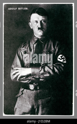 1930's B&W studio posed portrait photograph of Adolf Hitler in uniform wearing a swastika armband. Stock Photo