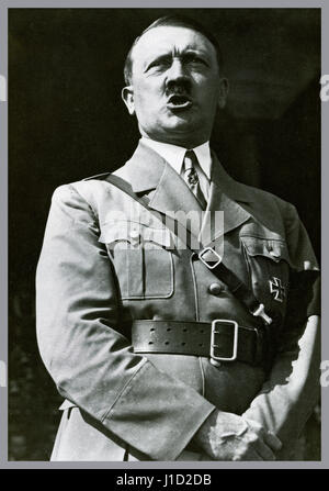 Adolf Hitler in uniform wearing a self awarded Iron Cross medal making a speech to a rally of Hitler Youth at Nuremberg Germany 1934 Stock Photo