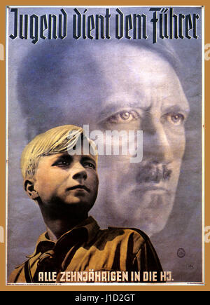 HITLER YOUTH PROPAGANDA VINTAGE NAZI NSDAP POSTER 1930's Adolf Hitler and young 8-12 years Aryan Boy Illustration German Nazi recruitment propaganda poster for 'Hitler Jugend' “Hitler Youth Serves The Leader”  Third Reich Germany Artist Hein Neuner Stock Photo