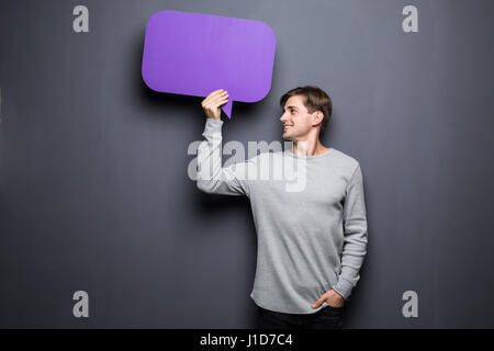 Man holding blank speech bubble with space for text Stock Photo