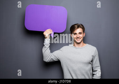 Man holding blank speech bubble with space for text Stock Photo