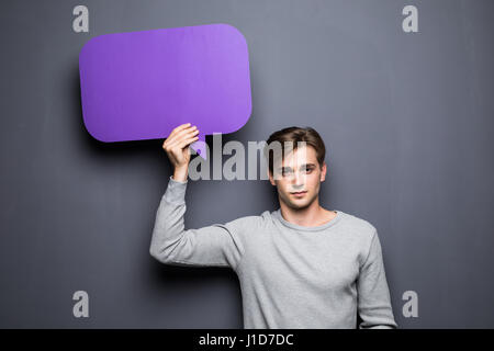 Man holding blank speech bubble with space for text Stock Photo