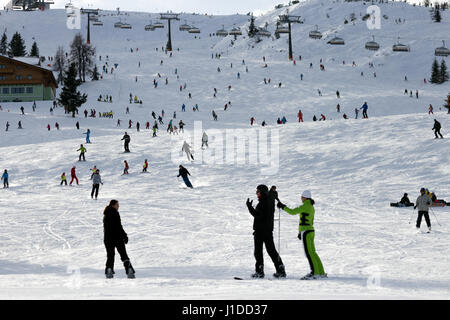 FLACHAU, AUSTRIA - DEC 27, 2012: Ski pistes near the ski resort town of Flacha. These pistes are part of the Ski Armade network, the largest of Europe Stock Photo