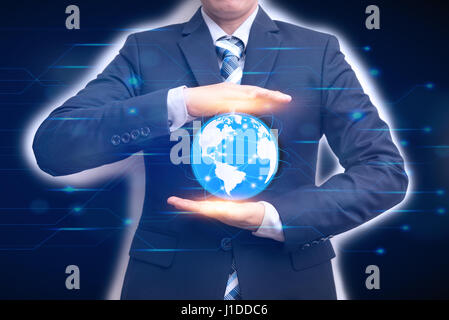 Technologies connecting the word with business man holding digital planet in hands on circuit background, Advanced technology concept Stock Photo