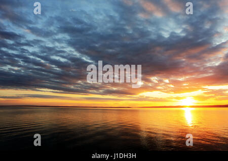 Sunset over ocean Stock Photo