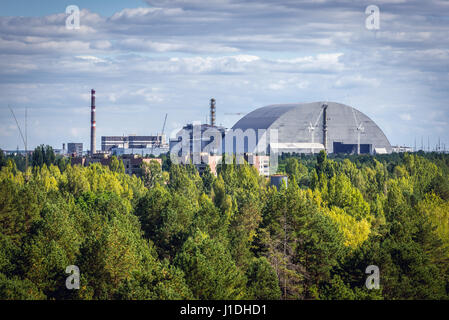 Chernobyl New Safe Confinement seen from Jupiter factory in Chernobyl Nuclear Power Plant Zone of Alienation in Ukraine Stock Photo