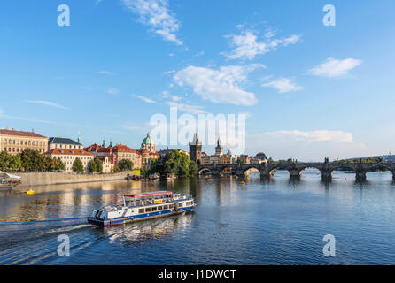 Prague. Cruise boat on the Vltava river looking towards the Charles Bridge, Prague, Czech Republic Stock Photo