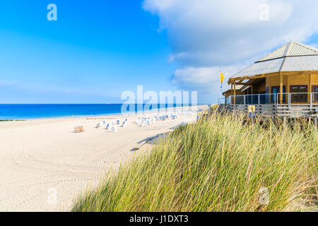 SYLT ISLAND, GERMANY - SEP 6, 2016: grass on sand dune and beach restaurant on Sylt island, Germany. Stock Photo