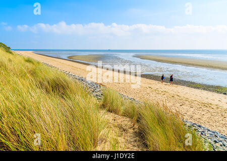 SYLT ISLAND, GERMANY - SEP 6, 2016: couple of people walking along List beach, Sylt island, Germany. Stock Photo