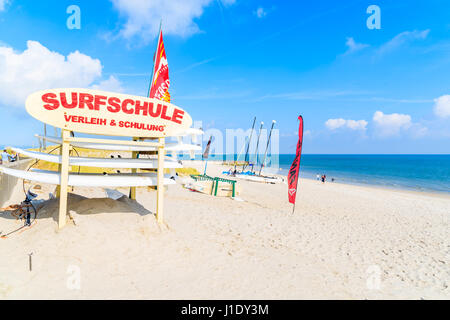 SYLT ISLAND, GERMANY - SEP 6, 2016: Sign of surfing school on sandy List beach, Sylt island, Germany. Stock Photo