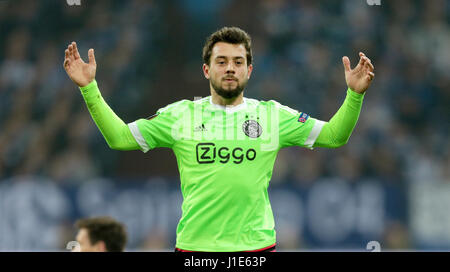 Gelsenkirchen, Germany. 20th Apr, 2017. Amin Younes of Amsterdam raises his hands during the UEFA Europe League quarter-final 2nd leg soccer match between FC Schalke 04 and Ajax Amsterdam in the Veltins Arena in Gelsenkirchen, Germany, 20 April 2017. Photo: Ina Fassbender/dpa/Alamy Live News Stock Photo