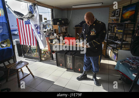 Tijuana, Baja California, Mexico. 18th Mar, 2017. HECTOR BARAJAS, 40, a veteran of the U.S. 82nd Airborne, buttons the last buttons on his uniform Saturday at the Bunker before the start of an event. A gathering of about 20 veterans living in Tijuana who fought for branches of the U.S. military and were deported after being discharged from service, welcomed supporters Saturday at their ''bunker'' outpost. Credit: E. Peggy Peattie/zReportage.com/ZUMA Wire/Alamy Live News Stock Photo