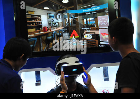 Bangkok, Thailand. 21st Apr, 2017. A visitor tries on a virtual reality (VR) gaming device during Thailand Comic Con 2017 in Bangkok, Thailand, April 21, 2017. Thailand Comic Con 2017, a three-day event that features animations, cartoons, video games and other related activities and products, was launched in Bangkok on Friday. Credit: Rachen Sageamsak/Xinhua/Alamy Live News Stock Photo