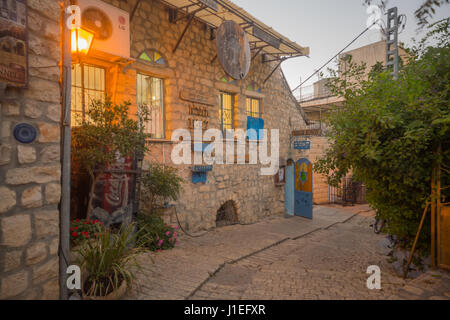 SAFED, ISRAEL - SEPTEMBER 14, 2016: An alley in the Jewish quarter of the old city, with various signs, in Safed (Tzfat), Israel Stock Photo