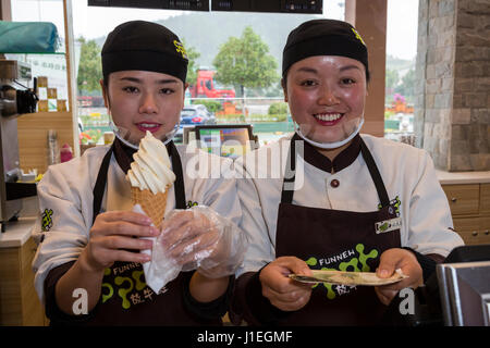 Guizhou, China.  Young Han Chinese Women Selling Ice Cream in a Roadside Rest Stop. Stock Photo