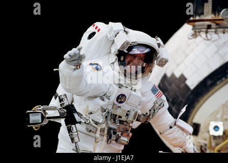 NASA STS-103 prime crew member Swiss astronaut Claude Nicollier of the European Space Agency waves to the crew aboard the Space Shuttle Discovery during an extravehicular activity spacewalk to repair the Hubble Space Telescope February 11, 2000 in Earth orbit.      (photo by NASA Photo /NASA   via Planetpix) Stock Photo