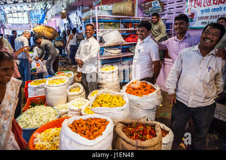 Man working in a flower market in Pune, India. Stock Photo