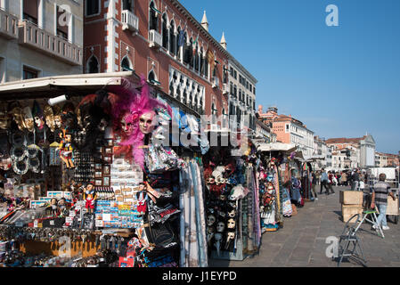 Souvenir stands on Riva degli Schiavoni waterfront promenade, Venice Stock Photo