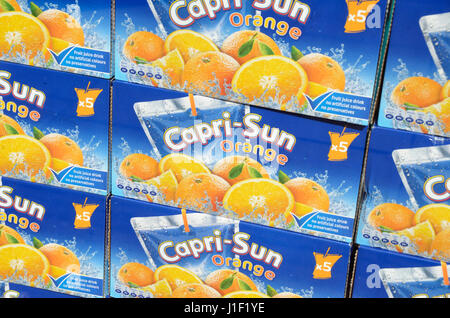 Boxes of Capri Sun orange drink displayed in a shop window. Stock Photo