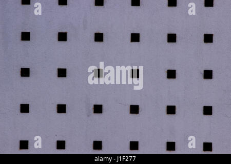 White metal plate texture with many small circular holes Stock Photo