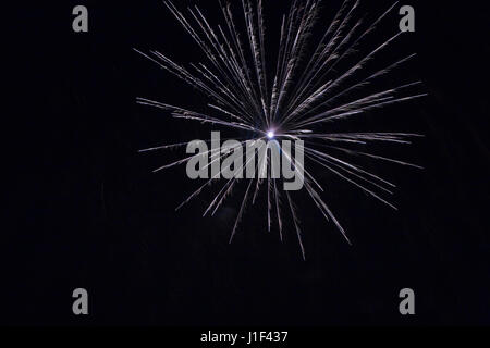 Blue, purple and white fireworks against a black sky background at night, La Ronde, Montreal, Quebec, Canada Stock Photo