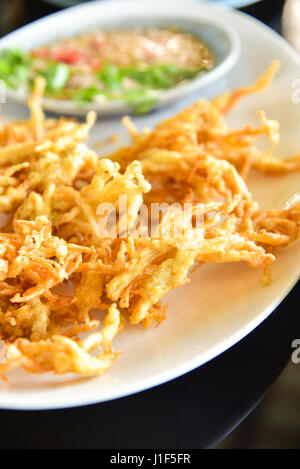 Enoki mushrooms fried Stock Photo