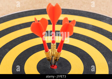 closeup one target with three dart arrows hitting the bullseye (goal). success business teamwork concept, abstract background Stock Photo