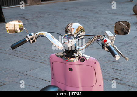 Vespa motorcycle and Arco de Cuchilleros reflected on headlight. Madrid, Spain. Stock Photo