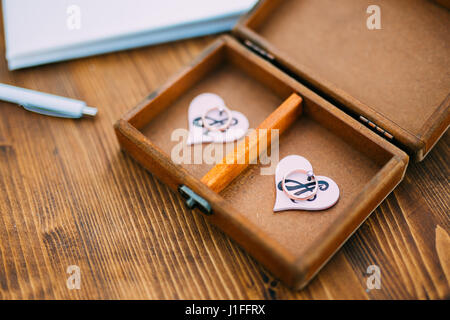Wedding rings of the newlyweds in a box. Engagement gold rings Stock Photo