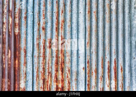 old rusty galvanized, corrugated iron siding vintage texture background Stock Photo