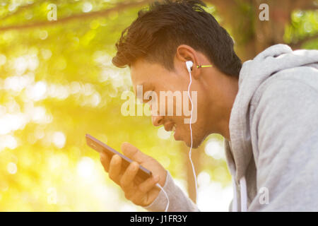 Handsome asian man using smartphone Stock Photo