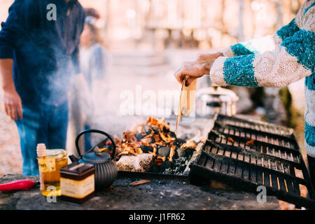 The guy fries a shish kebab on an open fire Stock Photo