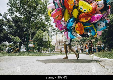 balloon vendor crossing a square in Belém, Pará, Brazil Stock Photo