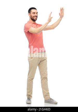 happy man touching something imaginary Stock Photo
