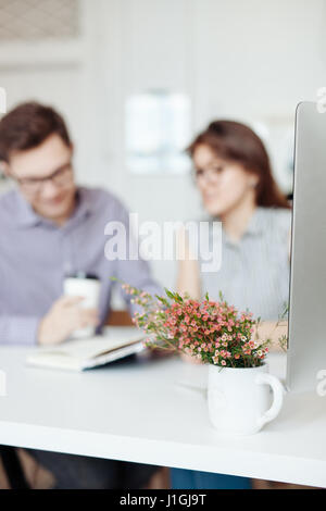Two creative designers working at white office Stock Photo