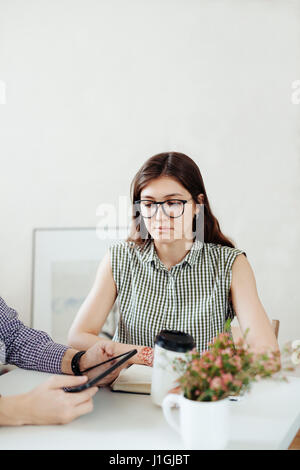 Two creative designers working at white office Stock Photo