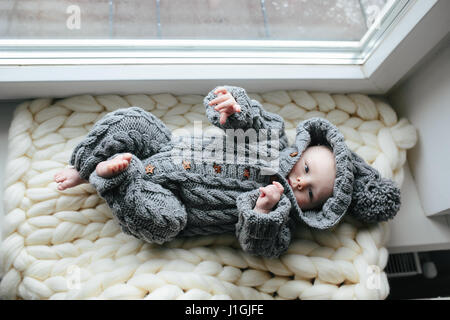Small baby in knitted clothes Stock Photo