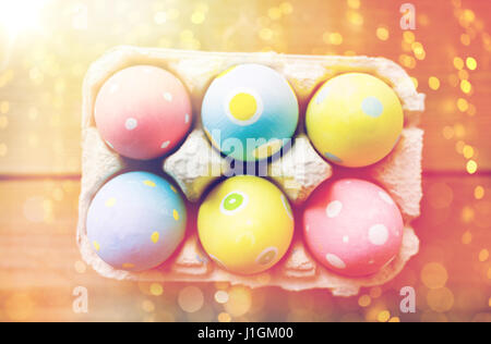 close up of colored easter eggs in egg box Stock Photo