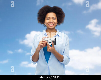 happy african american woman with film camera Stock Photo