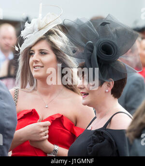 Racegoers arrive for Ladies Day of the Coral Scottish Grand National at Ayr Racecourse. Stock Photo